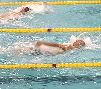 Texas A & M swimmer Riley Janes qualified first in the 100 Back.