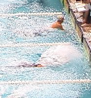 Ian Crocker finishing the 100 Fly.