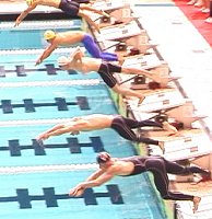 Ian Crocker, with his elbows up, finished first in the 100 Fly. Tommy Hannan, two lanes below him was second.