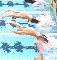 Lenny Krayzelburg (lower), and Aaron Peirsol on their way to qualifying in the 200 Back.