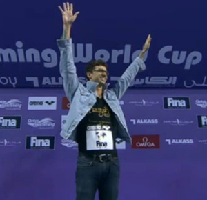 AE on podium in his jean jacket
