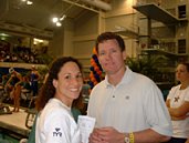 Auburn's Co-Head Coaches Kim Brackin and David Marsh beam as they watch their women's team all but wrap up a second-straight NCAA title.
