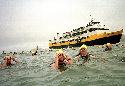 Photo by Peter Kapetanic

Masters swimmers  at the ALCATRAZ SHARKFEST swim sponsered by Envirosports( Date: Sunday July 29,2001)  
 
This picture shows swimmers (unknown) as they jump off the boat and swim toward the starting line.