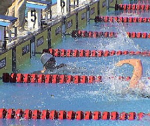 Jason Lezak gets to the wall well ahead of the field on his way to an American record.