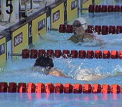 Katie Hoff touches the wall jsut ahead of Amanda Beard in the 200 IM final