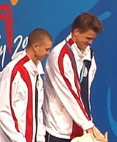 Gary Hall and Anthony Ervin share the gold medal stand in the 50 free.