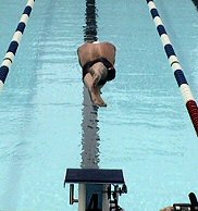 Brendon Hansen dives in for his breaststroke event at the 2004 Olympic Trials