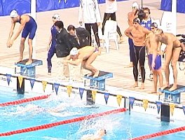 400 Medley Relay excahnge between Lenny Krayzelburg and Ed Moses. Moses had the fastest breaststroke relay split ever, breaking 1:00.00.