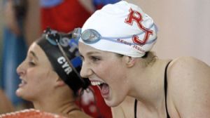 Regis Jesuit High School swimmer Missy Franklin cheers on teammates as they finish their event against Highlands Ranch.