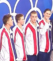 The American foursome of Lenny Krayzelburg, Ed Moses, Ian Crocker, and Gary Hall Jr. on the Stand for winning gold in the 400 Medley Relay.
