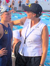 Natalie Coughlin receives congratulations from her coach, Teri McKeever, after setting the world record in the 100m backstroke at 2002 LCM Nationals.