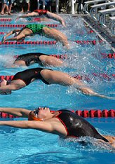 KEY LARGO, Fla., USA: Univeristy of Tennessee swimmers (three in foreground) begin the 50 meter backstroke event Saturday, Dec. 20, at the Orange Bowl Swimming Classic in Key Largo, Fla. Staged at the Jacobs Aquatic Center, the Classic marked the first time an Orange Bowl event was held in the Florida Keys. Tennesse won overall women's honors, while Harvard University won the overall men's title.
