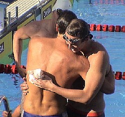 Novaquatics team-mates Aaron Peirsol and Lenny Krayzelberg congratulate each other with their 1-2 finish in the 100 Back final