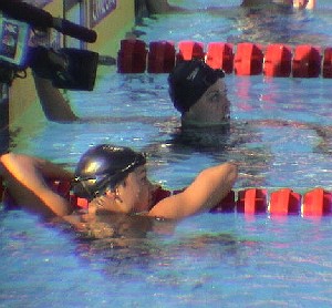 Tara Kirk & Amanda Beard check the clock after the 100 Breast