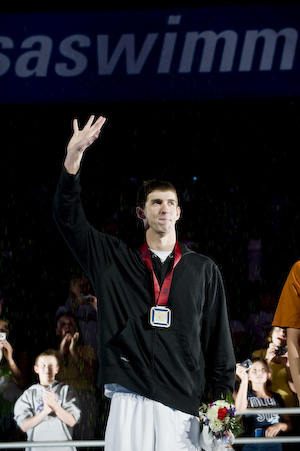 Michael Phelps accepts the award for winning the 100 meter butterfly.