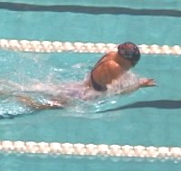 Megan Quann swimming to first in the 100 Breast.