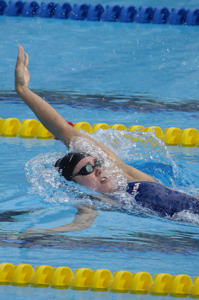 Coughlin wins 100 back semis