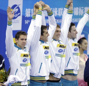 Shanghai, CHINA; Matthew Targett and Matthew Abood and James Magnussen and Eamon Sullivan celebrate after winning the gold medal in the men's 4x100m freestyle relay final at the 14th FINA World Championships.