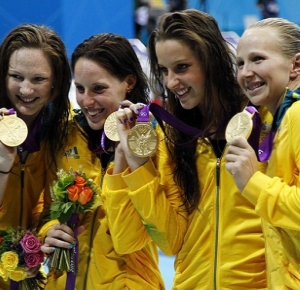 Australia relay members including Alicia Coutts , Cate Campbell , Brittany Elmslie and Melanie Schlanger pose with their gold medals after winning the women's 4x100m freestyle relay finals during the 2012 London Olympic Games at Aquatics Centre.
