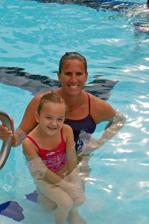 Swim by the C Owner/Coach CeCe Dugas with student Bailey Mitchell.