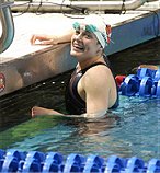 Becky short is all smiles after swimming 21.88 in prelims, making her fourth fastest woman all time.