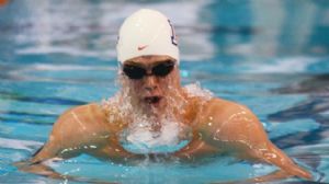 Kevin Cordes competes in the men's 100 yard breaststroke prelims during the U.S. Winter National Championships at the Texas Swimming Center.