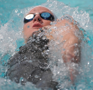 Kirsty Coventry (ZIM) swims during the women's 100-meter backstroke preliminaries in the Santa Clara International Invitational at the George F. Haines International Swim Center.