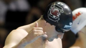 Michael Flach signals to the crowd before competing in the mens 200m butterfly final in the 2012 U.S. Olympic swimming team trials at the CenturyLink Center.