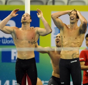 Shanghai, CHINA; Silver medalists Fabien Gilot and William Meynard and Jeremy Stravius and Alain Bernard react during the men's 4x100m freestyle relay final at the 14th FINA World Championships.