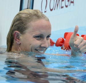Jessica Hardy (USA) reacts after coming in third in the women's 100 m freestyle heat during the London 2012 Olympic Games at Aquatics Centre.