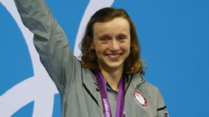 Katie Ledecky (USA) waves to the crowd after receiving her gold medal for winning the women's 800m freestyle final during the London 2012 Olympic Games at Aquatics Centre.