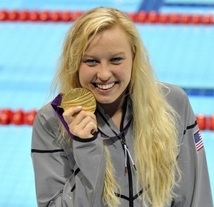 Jessica Long (USA) shows off her medal after the medal ceremony for the women's 200 IM - SM8 during the London 2012 Paralympic Games at Aquatics Centre.