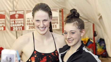 Fans take pictures with Regis Jesuit High School swimmer Missy Franklin after a meet against Highlands Ranch.