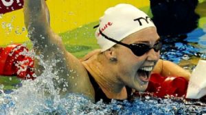 Gold medalist Jeanette Ottesen (DEN) celebrates after the women's 100m freestyle final of the 14th FINA World Championships at the Oriental Sports Center.