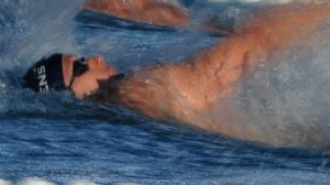 Kyle Owens (USA), bottom, swims during the men's 200-meter backstroke B-final in the USA swimming national championship at the Avery Aquatic Complex.