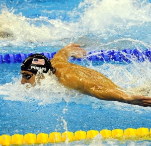 Shanghai, CHINA; Michael Phelps (USA), bottom, competes in the men's 100m Butterfly semifinal of the 14th FINA World Championships at the Oriental Sports Center.