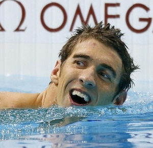 Michael Phelps (USA) reacts after anchoring the USA team to victory in the men's 4x200m freestyle relay finals during the London 2012 Olympic Games at Aquatics Centre.