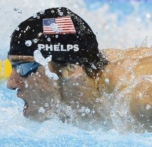 Michael Phelps (USA) competes in the men's 100m butterfly semifinals during the London 2012 Olympic Games at Aquatics Centre.