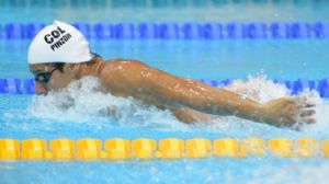 Omar Pinzon (COL) swims in a men's 200m butterfly heat during the 2012 London Olympic Games at Aquatics Centre.