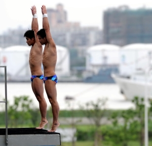 Qiu Bo and Huo Liang (CHN) compete in the men's 10m platform synchro final during day two of the 14th FINA World Championships at the Oriental Sports Center.
