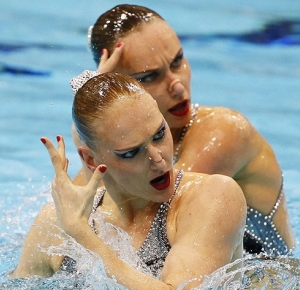 Natalia Ishchenko and Svetlana Romashina (RUS) perform their technical routine during qualifications during the London 2012 Olympic Games at Aquatics Centre.