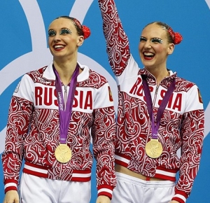 Natalia Ishchenko and Svetlana Romashina (RUS) stand on the podium after winning the gold in the duet final during the London 2012 Olympic Games at Aquatics Centre.