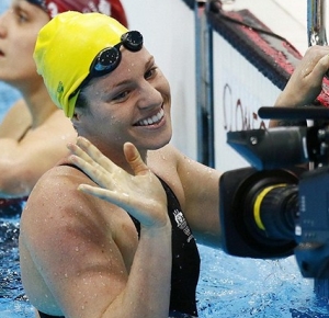 Emily Seebohm (AUS) reacts after competing during the women's 100m backstroke heats during the 2012 London Olympic Games at Aquatics Centre