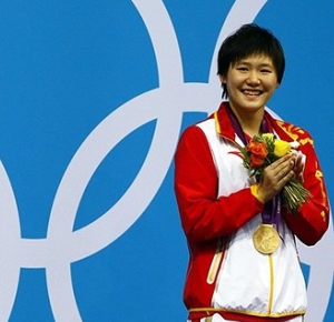 Shiwen Ye (CHN) stands on the podium with the gold medal after winning the women's 400m individual medley finals during the 2012 London Olympic Games at Aquatics Centre.