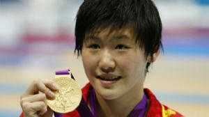 Ye Shiwen (CHN) poses with her gold medal after winning the women's 200m individual medley finals during the London 2012 Olympic Games at Aquatics Centre.