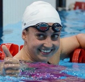Rebecca Soni (USA) reacts after she places first in her run in the women's 200m breaststroke heat during the London 2012 Olympic Games at Aquatics Centre.