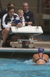 Olympian Roque Santos and daughter root for mom, Debbie Santos at USMS Nationals, IUPUI 2004