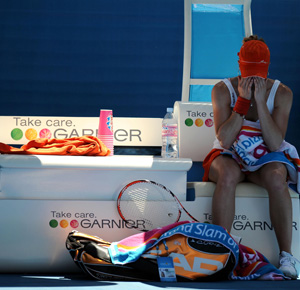 Alize Cornet (FRA) reacts between sets against Dinara Safina (not pictured) during the fourth round of the 2009 Australian Open at Melbourne Park.