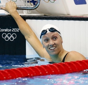 Dana Vollmer (USA) reacts after winning a women's 100m butterfly heat during the 2012 London Olympic Games at Aquatics Centre.