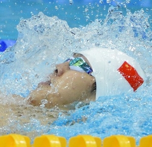 Fenglin Zhang (CHN) swims to place second in his run of the men's 200m backstroke heat during the London 2012 Olympic Games at Aquatics Centre.